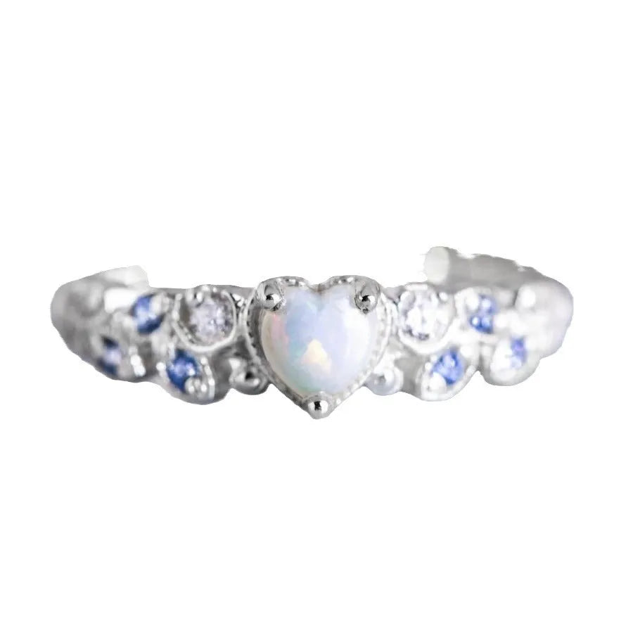 White alloy women's heart-shaped ring with a flower opal ocean design centrepiece.