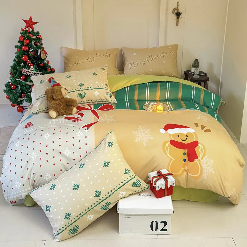 Christmas cartoon themed four-piece bedding set with duvet cover, fitted sheet and pillowcases on a bed.