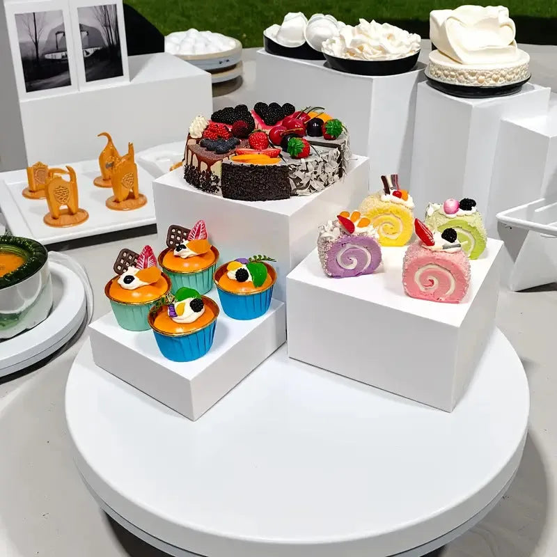 White plastic suit cube dessert display stand with six stackable pieces for table presentation