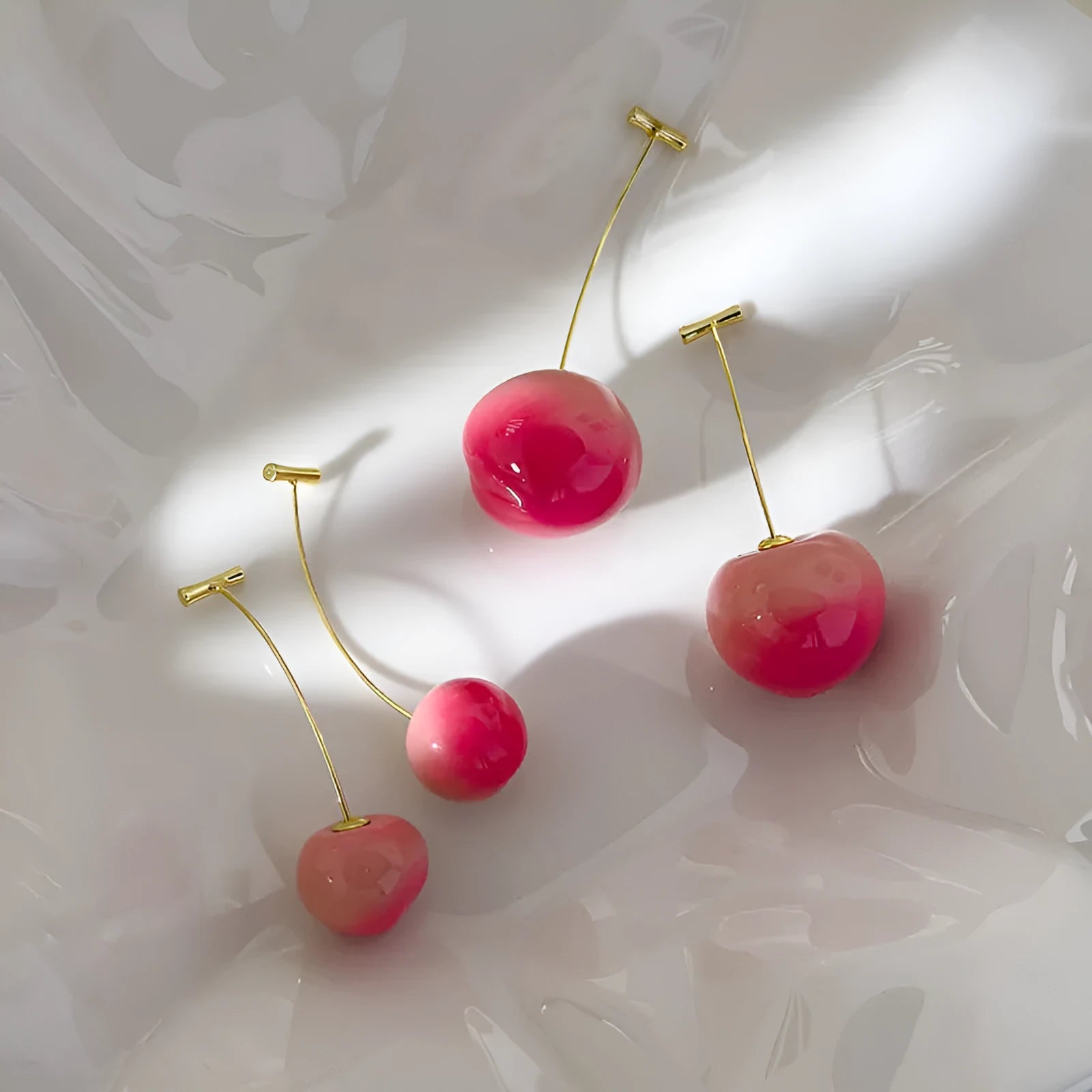 Juicy Peach fruit-shaped acrylic earrings on copper posts, shown in small and large size variants.