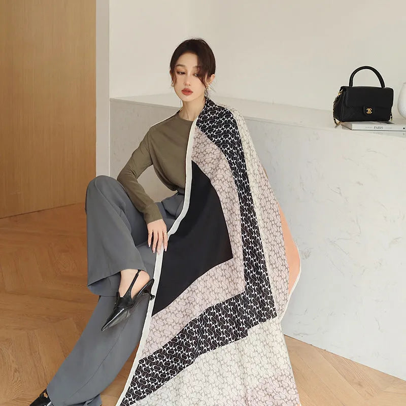 A woman's elegant polyester shawl scarf in a mid-length style, dimensions 180cm by 90cm.