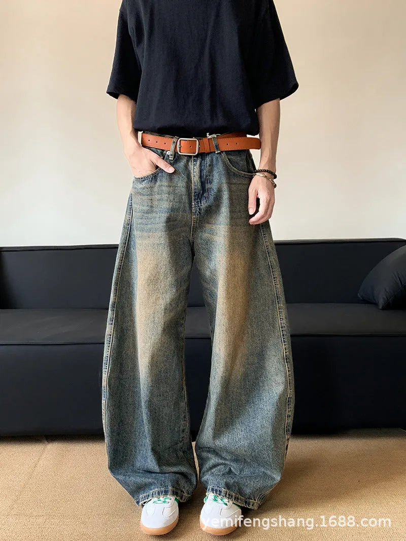 Men's retro blue distressed wide-leg jeans with micro-elastic cotton blend fabric showing distressed detailing