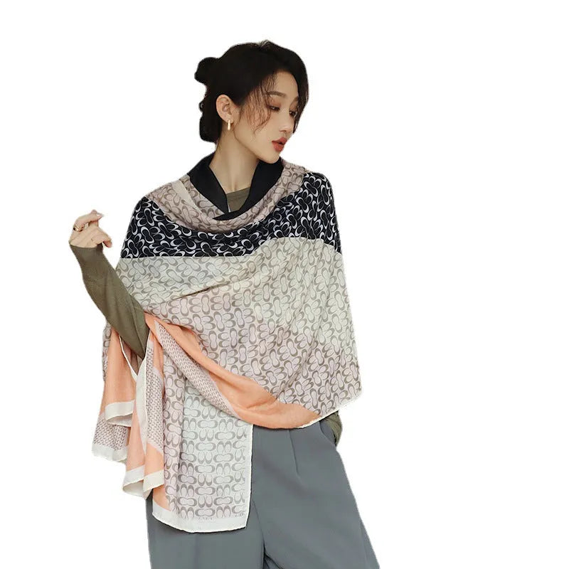 A woman's elegant polyester shawl scarf in a mid-length style, dimensions 180cm by 90cm.