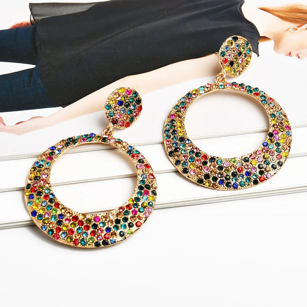 Colourful round pendant earrings with metal diamond detailing and cartoon style