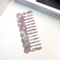 Acetate hair comb with geometric retro wave design in various colours.