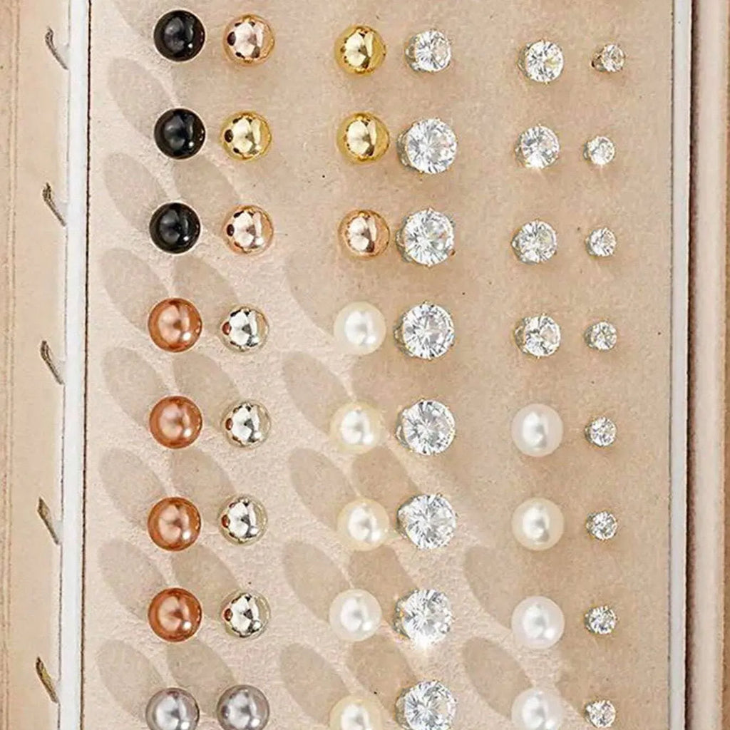 108 gold and yellow geometric alloy earrings with round bead details laid out flat.