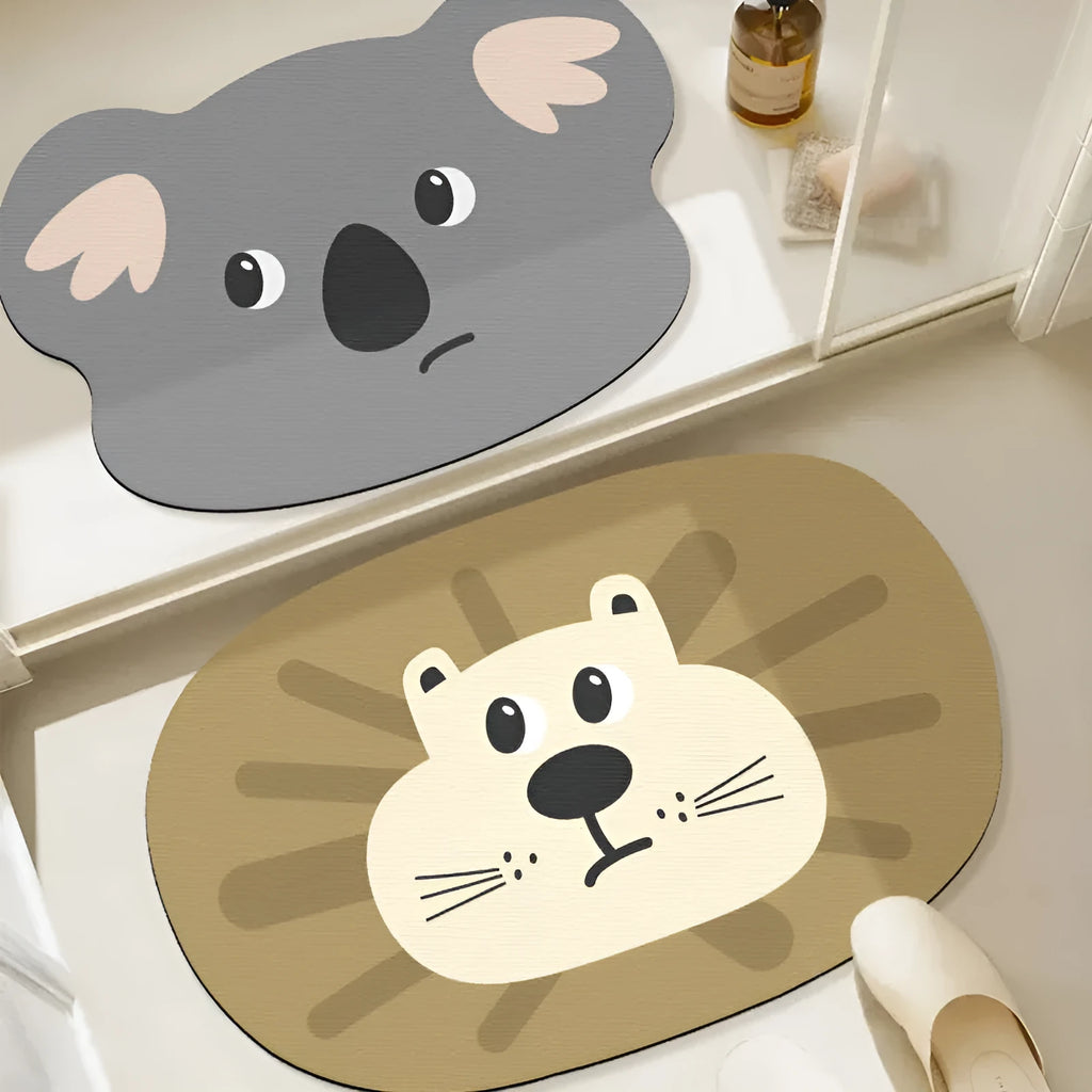 Cartoon animal diatom ooze absorbent bathroom mat in alien shape on bathroom floor.