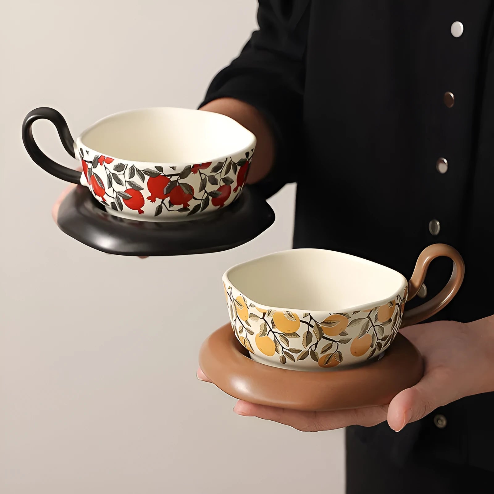 Antique style ceramic coffee cup and saucer set with medieval design in black or orange