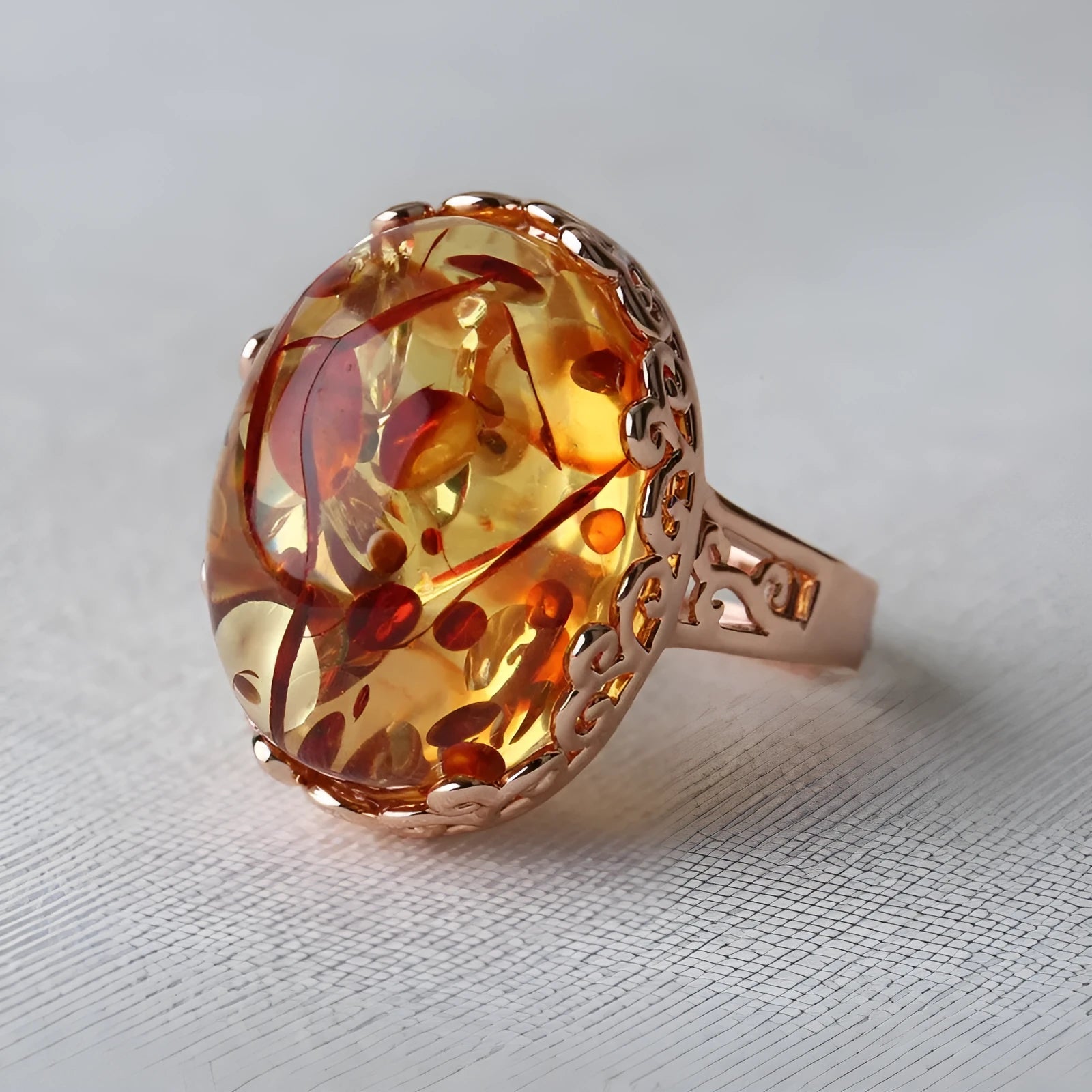Amber beeswax ring with natural stone in ethnic style on alloy band