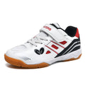 White and blue low-top badminton shoes with a ribbed sole and casual round-toe design on a court surface.