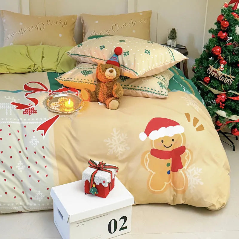 Christmas cartoon themed four-piece bedding set with duvet cover, fitted sheet and pillowcases on a bed.