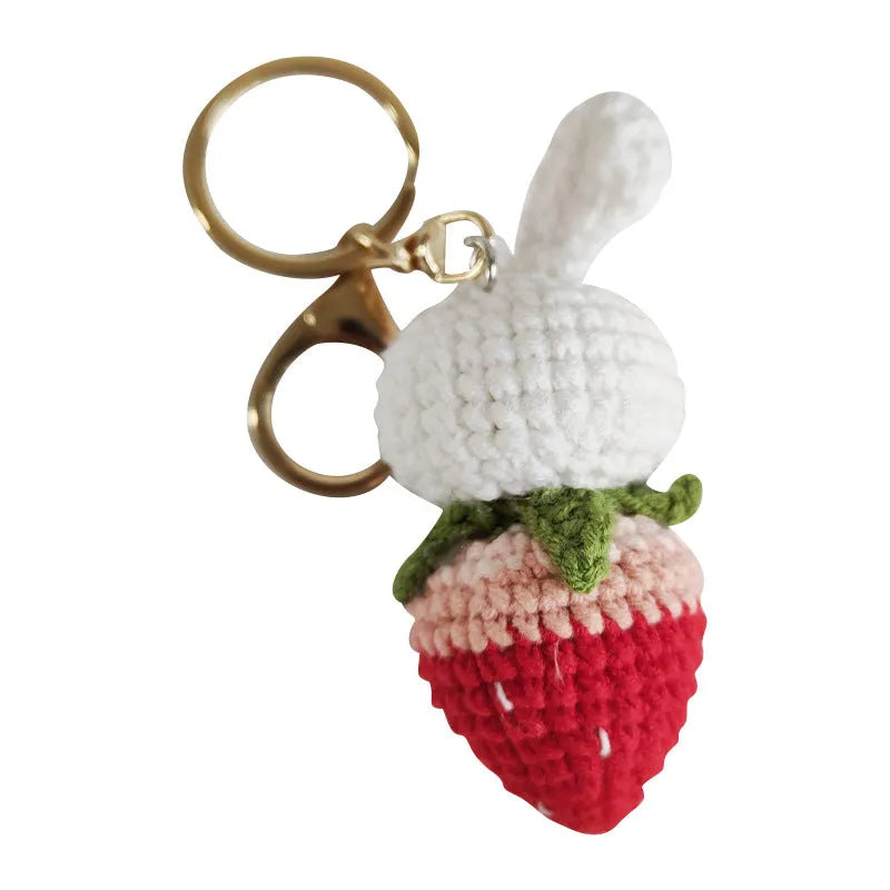 White hand-woven wire pendant with rabbit strawberry pattern and keychain attachment