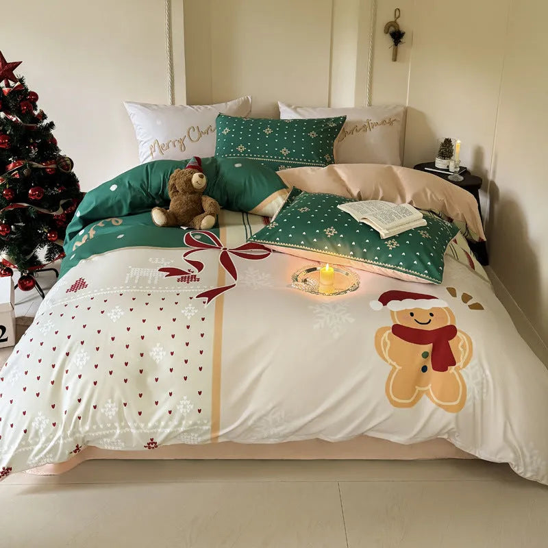 Christmas cartoon themed four-piece bedding set with duvet cover, fitted sheet and pillowcases on a bed.