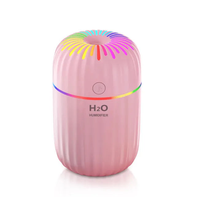 Mini animal-shaped USB aromatherapy humidifier in green, pink, or white, showing compact size.
