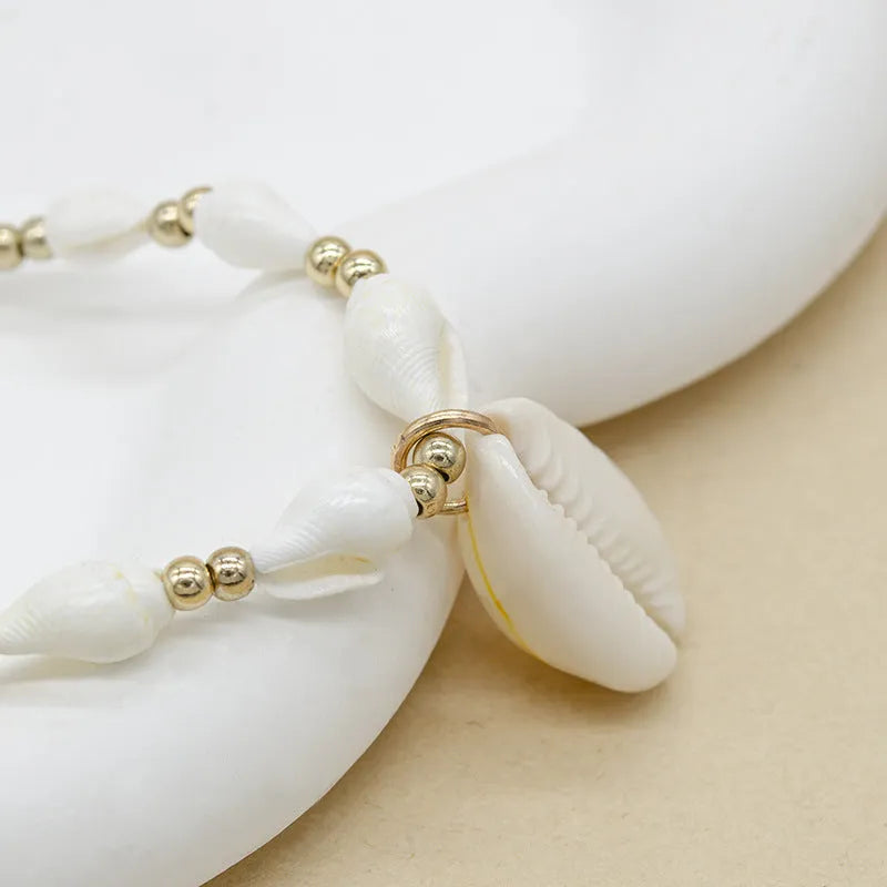 White conch shell bead necklace with mother pearl pendant on regular chain, electroplated finish