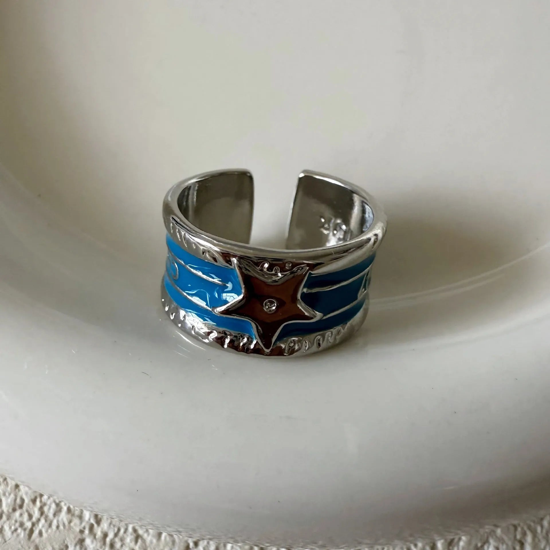 Adjustable retro-style geometric copper ring with line detailing and electroplated finish.