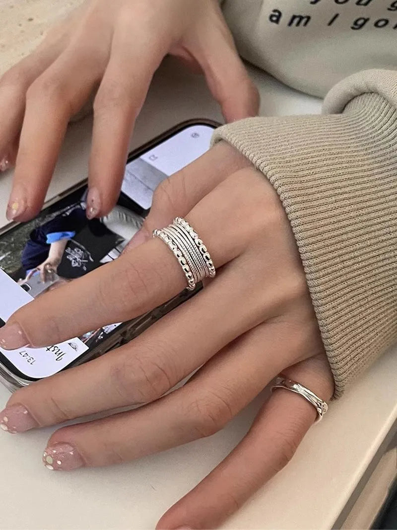 Women's geometric ring with woven twisted multilayer design and adjustable opening