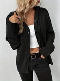 A solid colour hooded cardigan sweater with a textured 3D pattern, shown in a loose fit.