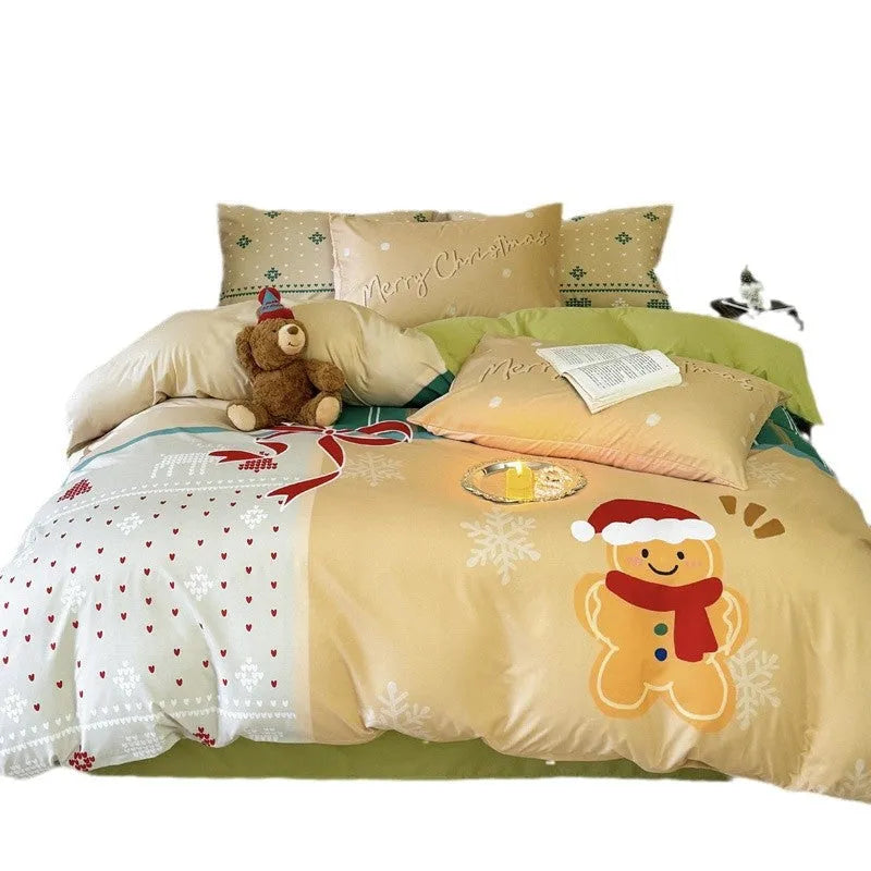 Christmas cartoon themed four-piece bedding set with duvet cover, fitted sheet and pillowcases on a bed.