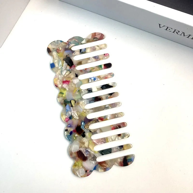 Acetate hair comb with geometric retro wave design in various colours.