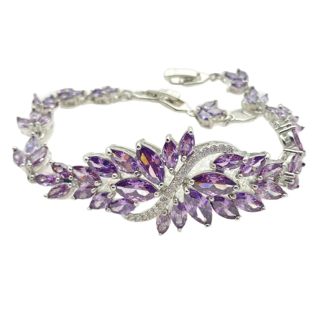 Gold electroplated bracelet with colourful zircon stones and ice flower pattern detailing on copper base