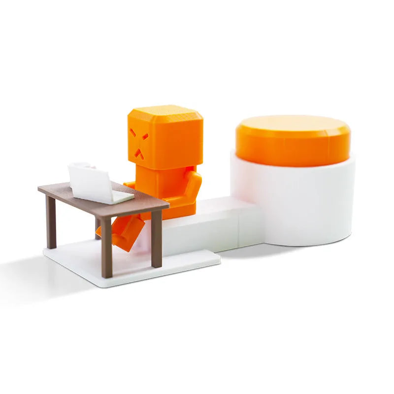 Orange plastic table turning decompression toy measuring 16cm long on a desk