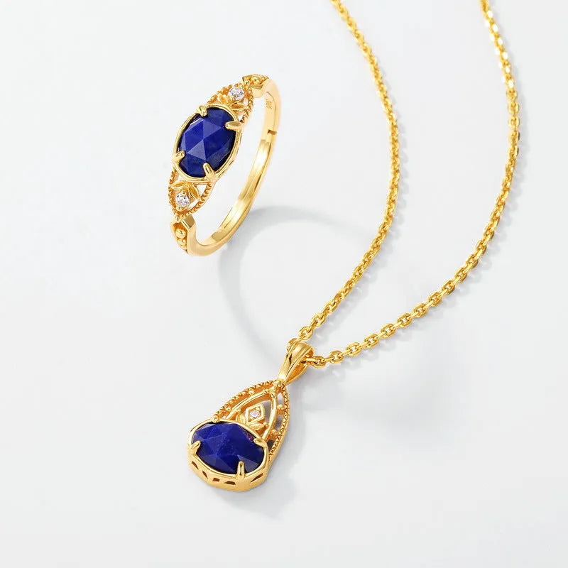 Geometric ellipse silver alloy ring with a round blue lapis lazuli stone, Japanese style design.