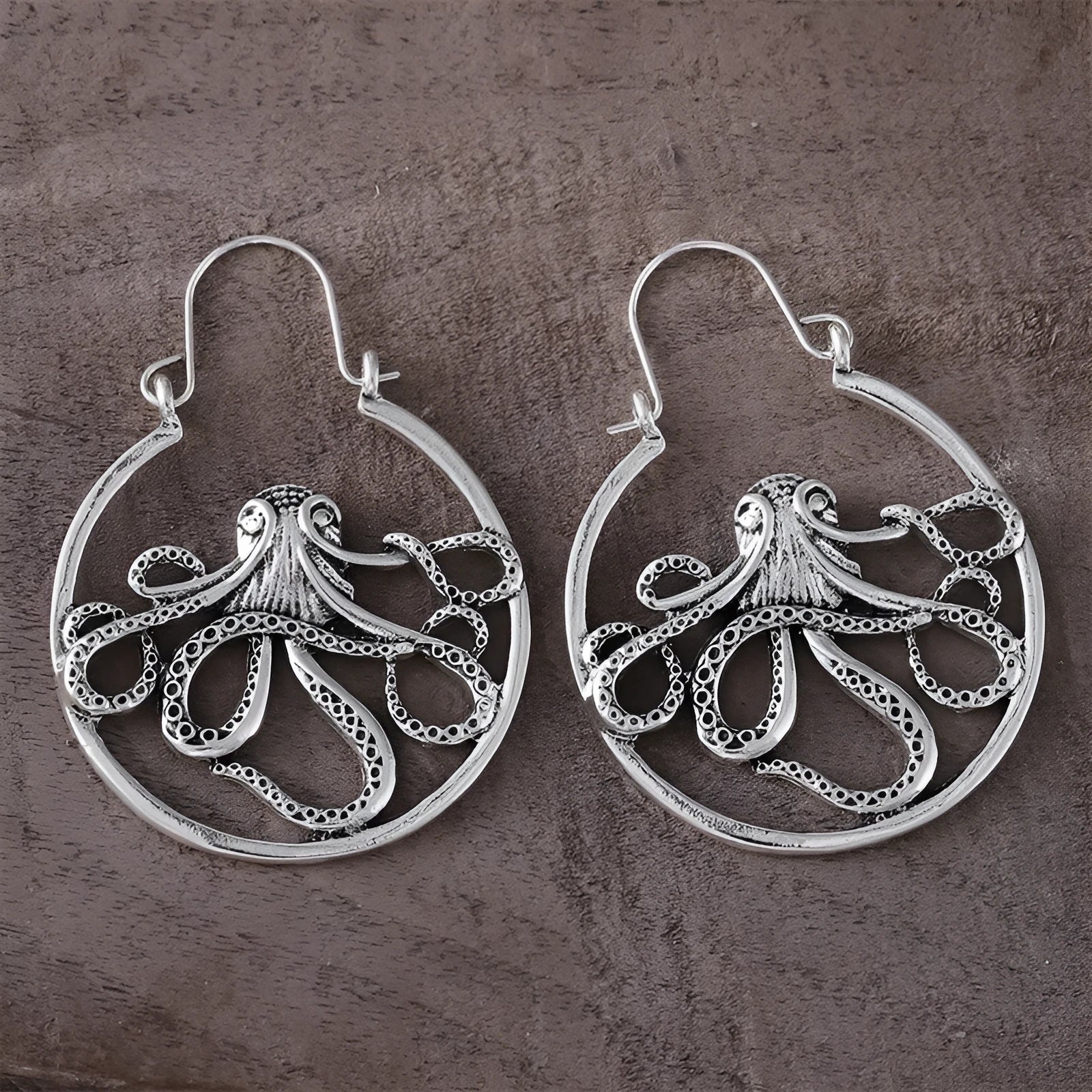 Antique silver octopus earrings with retro styling on zinc alloy construction