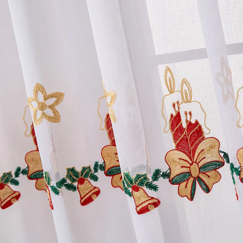 A pair of American-style Christmas curtains with white embroidered snowflakes on a red background.