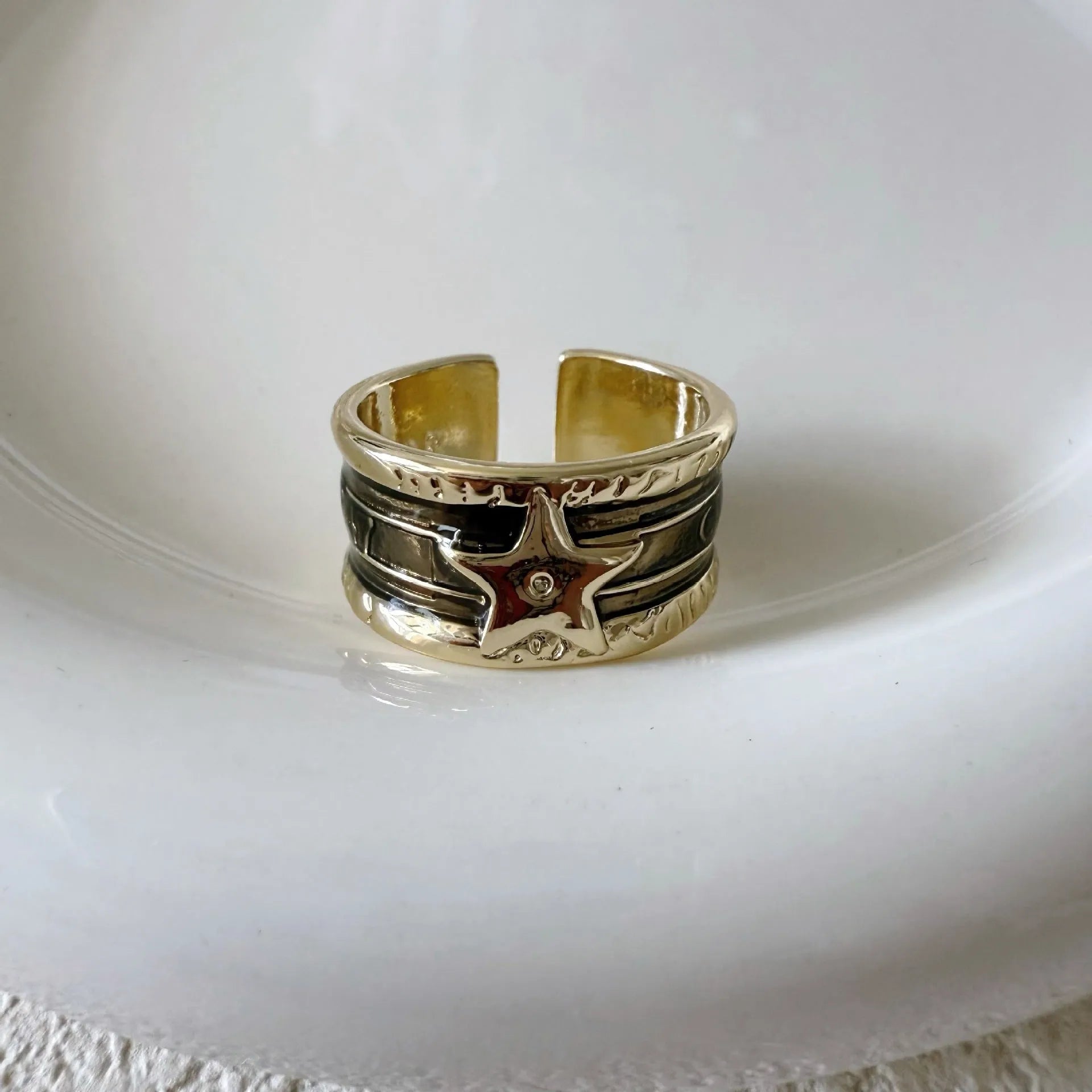 Adjustable retro-style geometric copper ring with line detailing and electroplated finish.