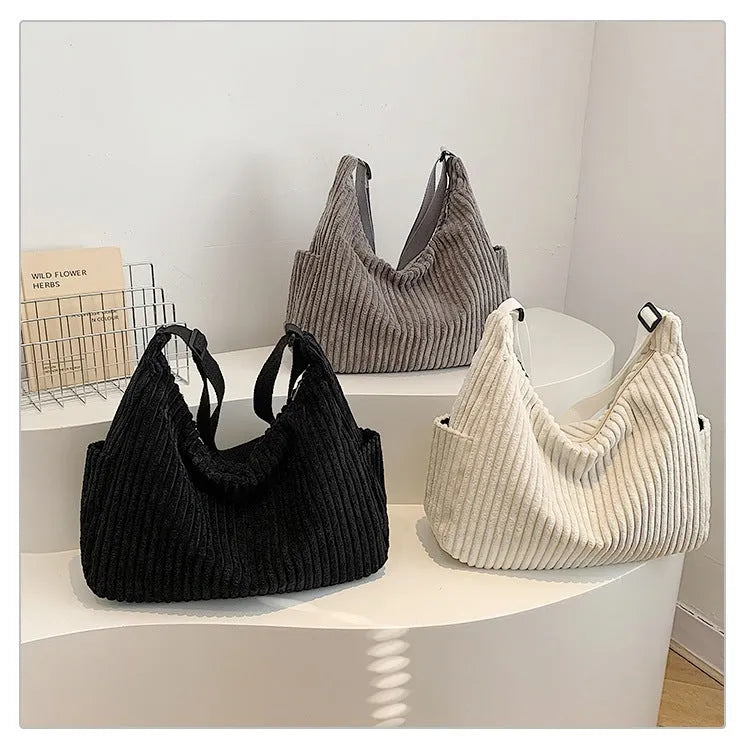 Corduroy crossbody bag in black, white or grey with single strap and sandwich pocket
