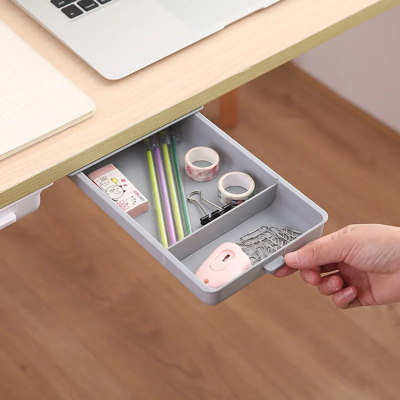 Plastic under-table storage drawer with lid open, showing internal grid, in choice of colours.