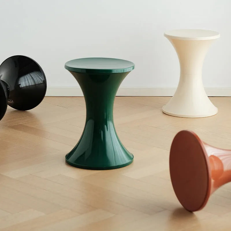 A plastic hourglass-shaped shoe changing stool in a choice of five colours.