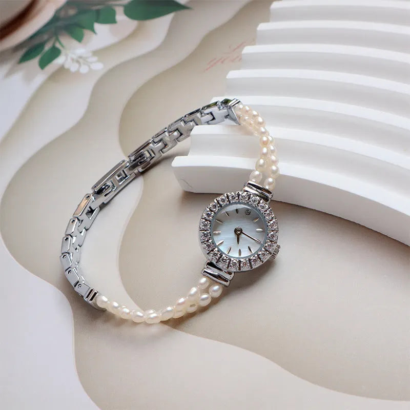 Women's light gold watch with freshwater pearl bracelet and round 18mm dial