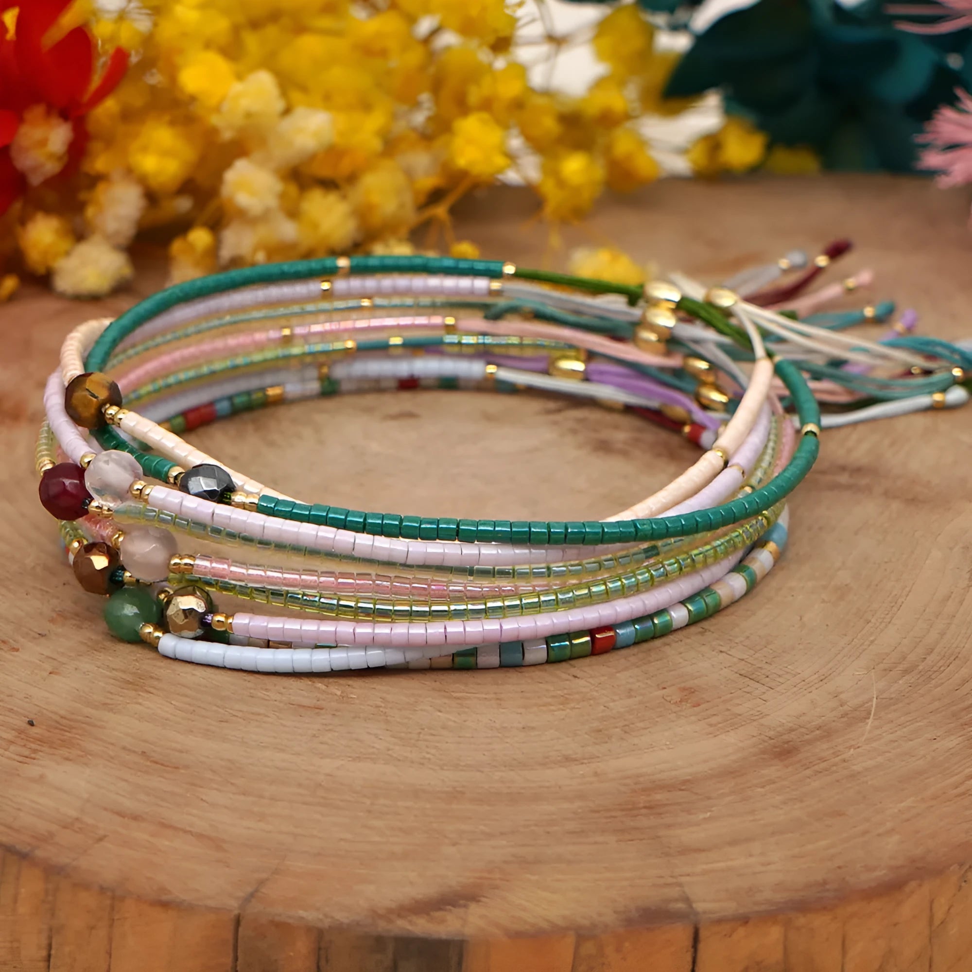 Handmade bohemian bracelet with colourful semi-precious stones and glass beads in geometric patterns.