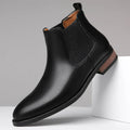 Men's black pointed-toe Chelsea boots with a high-top, mid-calf design and a low rubber sole.