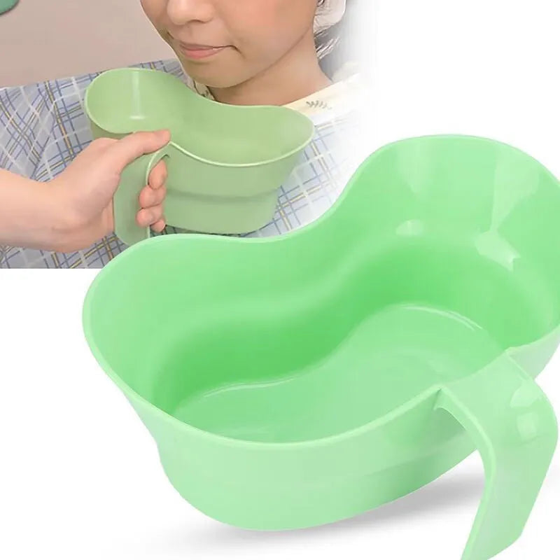 Green plastic gargle cup for elderly patient oral care assistance