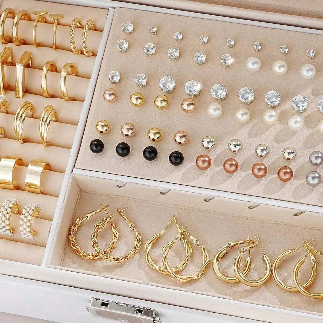 108 gold and yellow geometric alloy earrings with round bead details laid out flat.