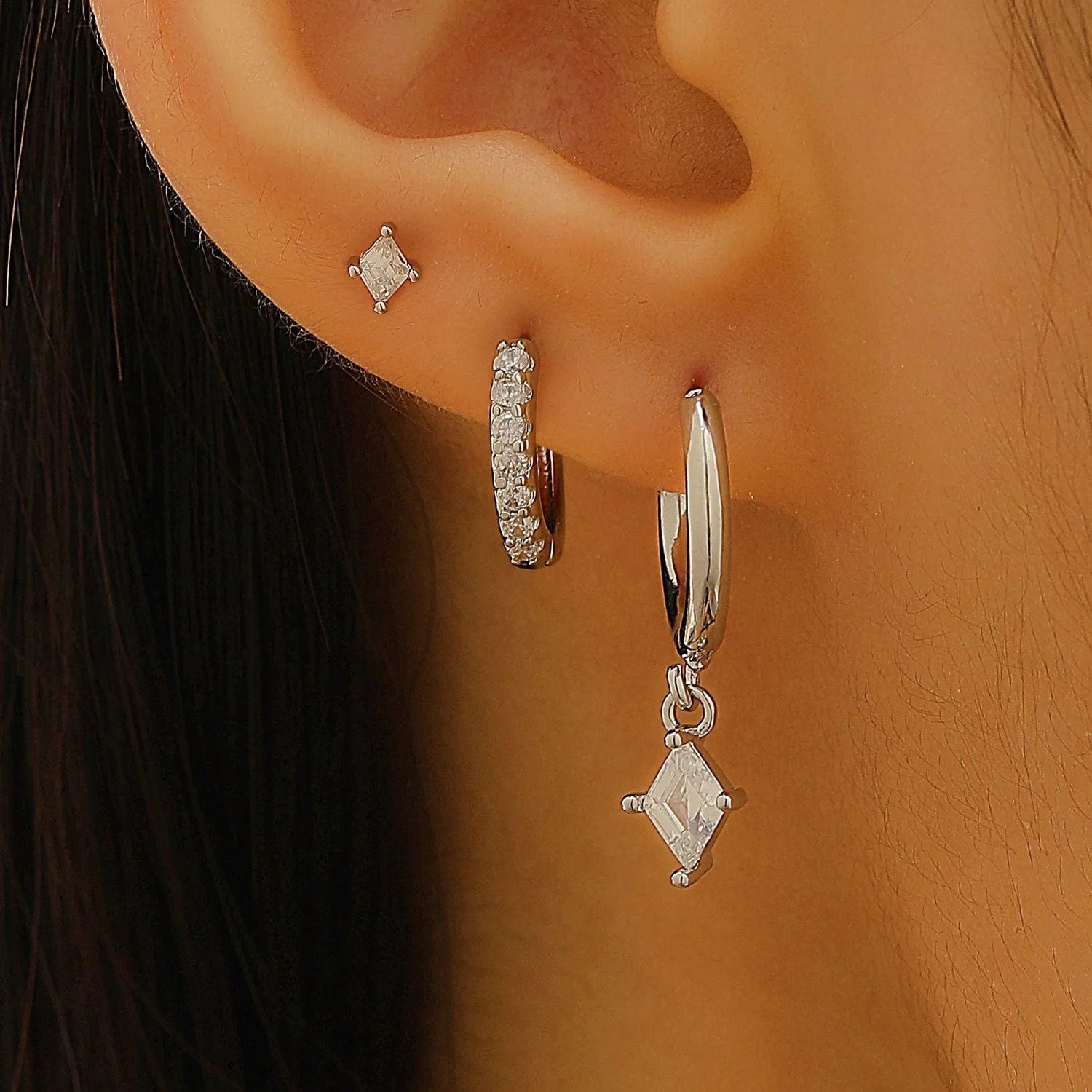 Ladies three-piece earring set with geometric design and zircon inlaid accents in gold colour