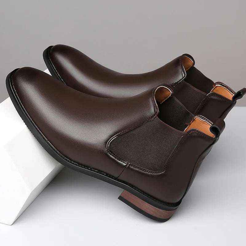 Men's black pointed-toe Chelsea boots with a high-top, mid-calf design and a low rubber sole.