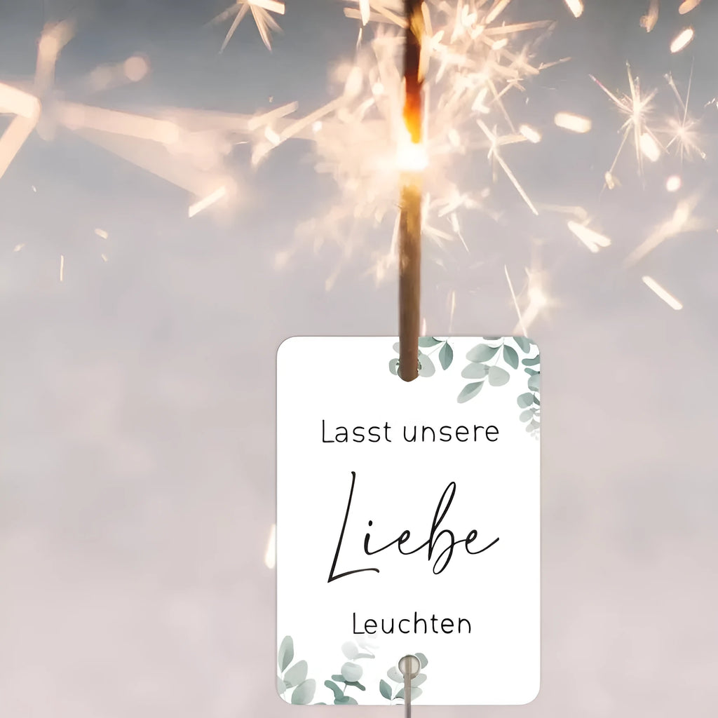Pack of 50 white decorative paper labels with a red and gold fireworks design for celebrations.