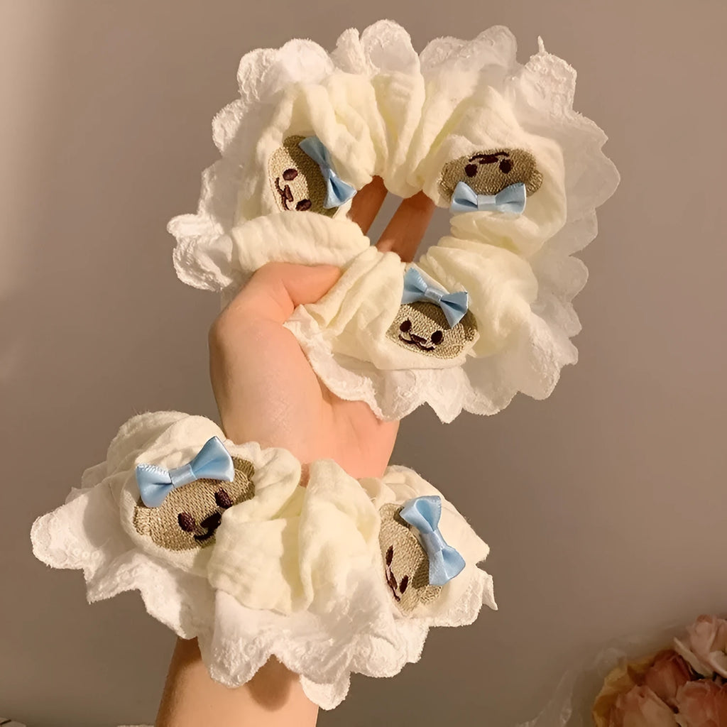 Blue cloth hair ring with cute bear and bow design in a large intestine loop style.