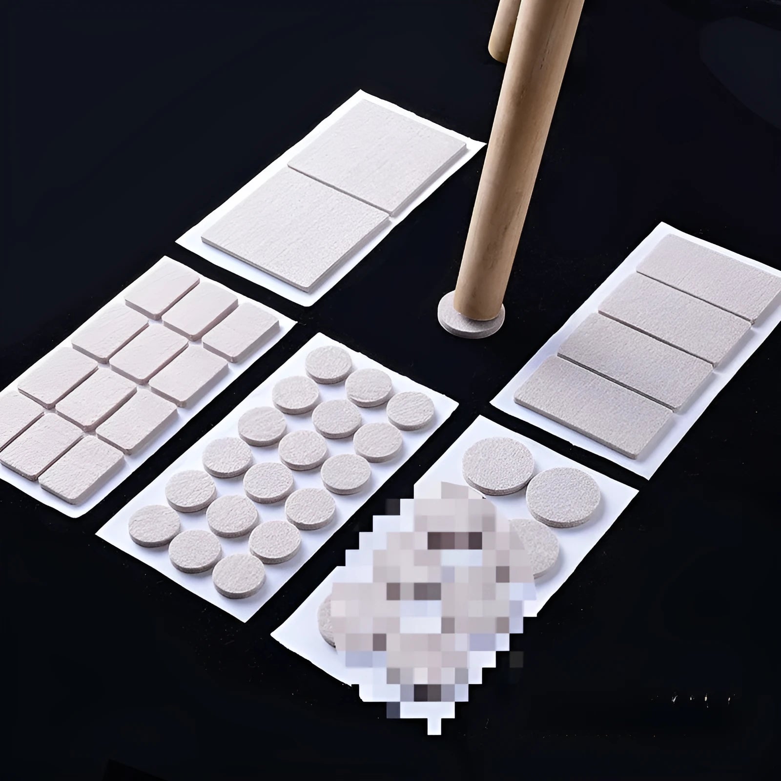 Assortment of beige plastic furniture leg protector pads in round and square shapes on a floor