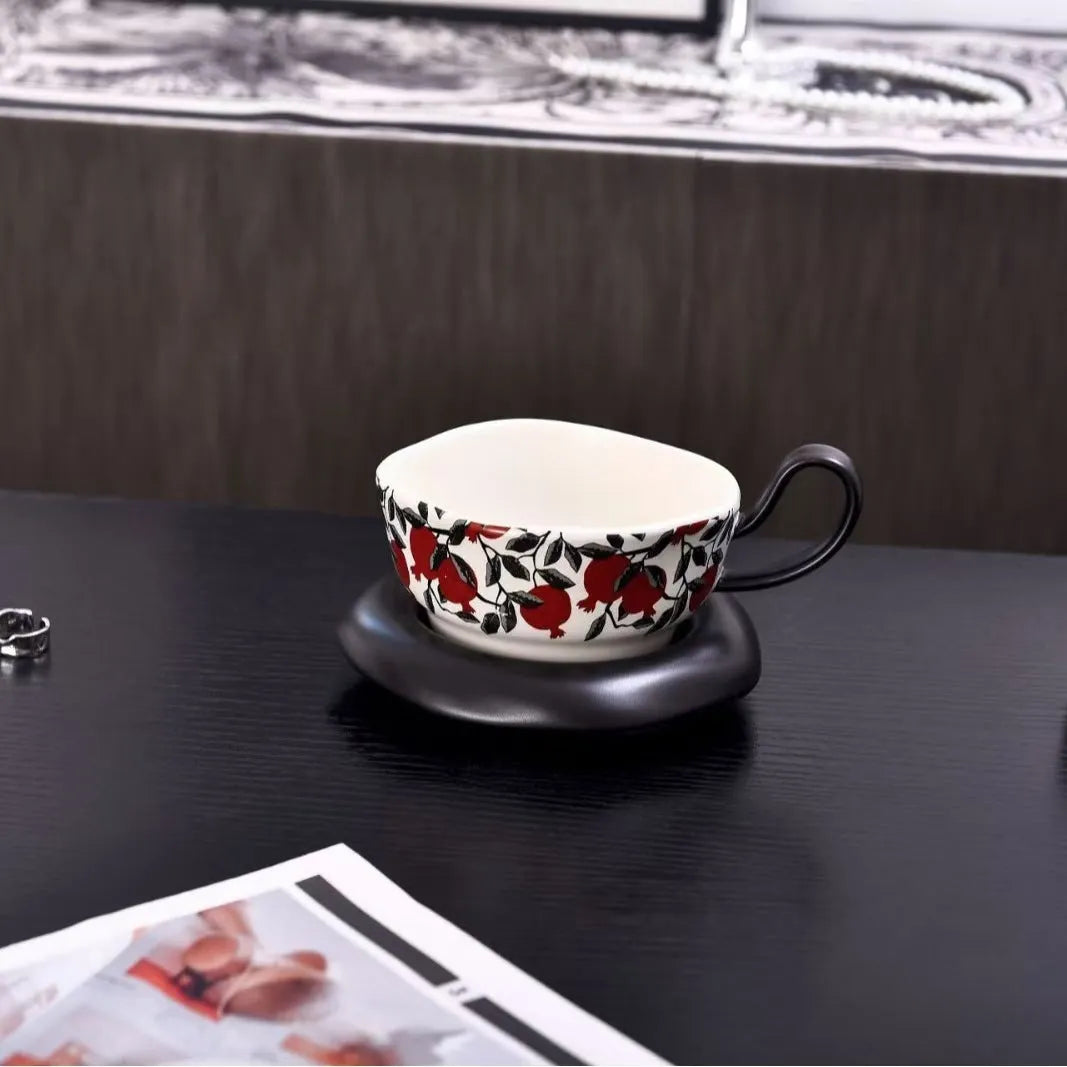 Antique style ceramic coffee cup and saucer set with medieval design in black or orange