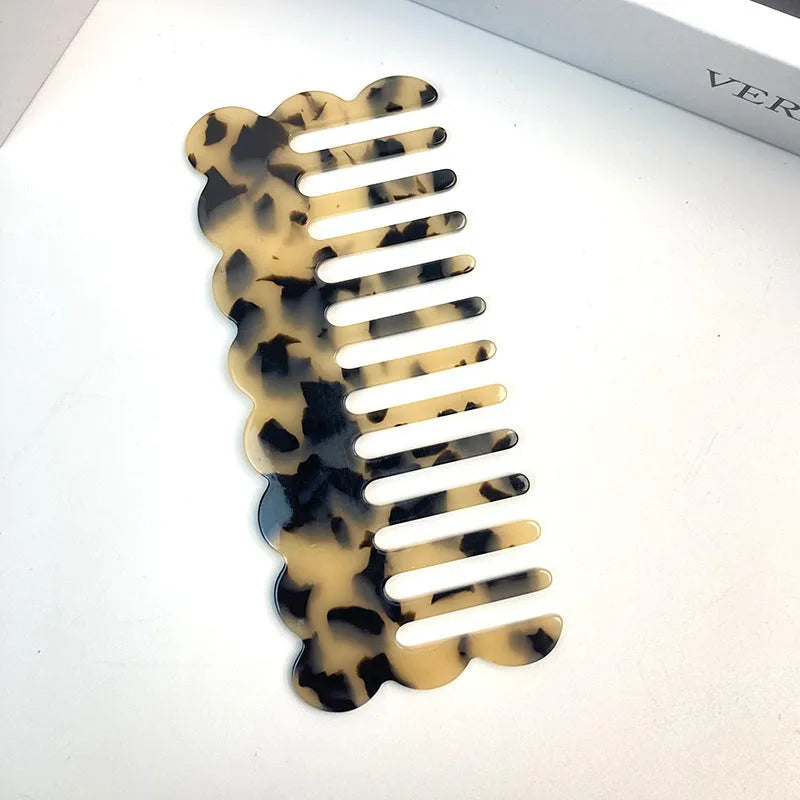 Acetate hair comb with geometric retro wave design in various colours.