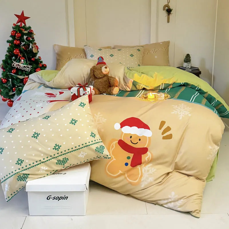 Christmas cartoon themed four-piece bedding set with duvet cover, fitted sheet and pillowcases on a bed.