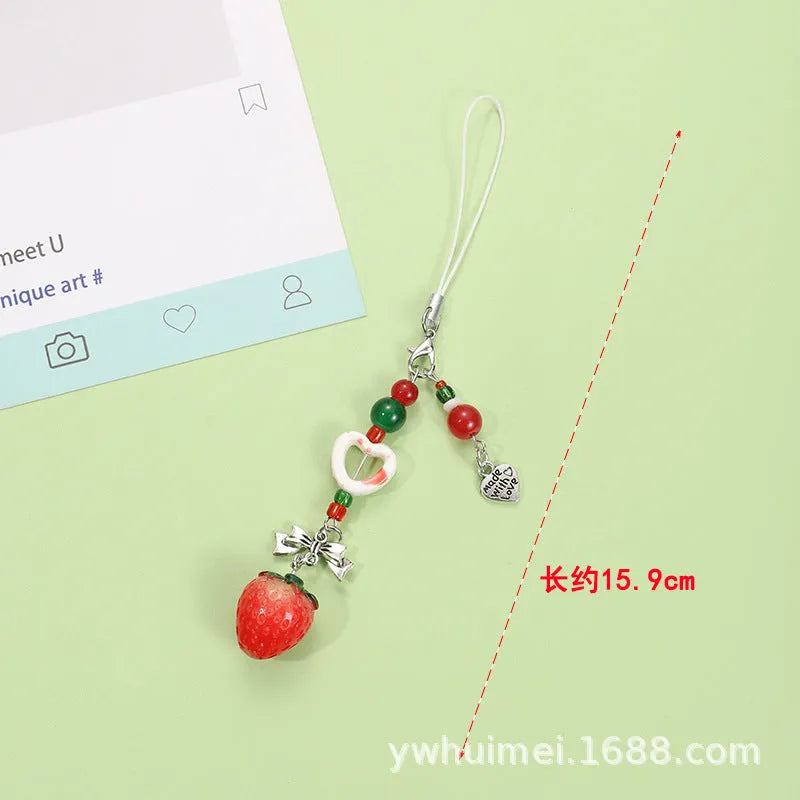 Fruit mobile phone charm keychain with apple, strawberry designs on plastic/resin with rope attachment