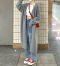 Loose large knitted cardigan for women in thick chenille fabric, shown in dark gray colour.