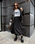 Women's solid colour long cotton skirt in black on a hanger