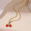 Stainless steel strawberry fruit pendant necklace for women showing red and white gradient colour options